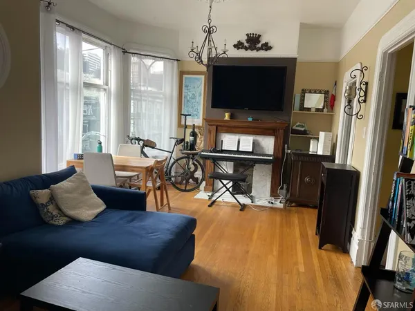 a living room with furniture and a flat screen tv