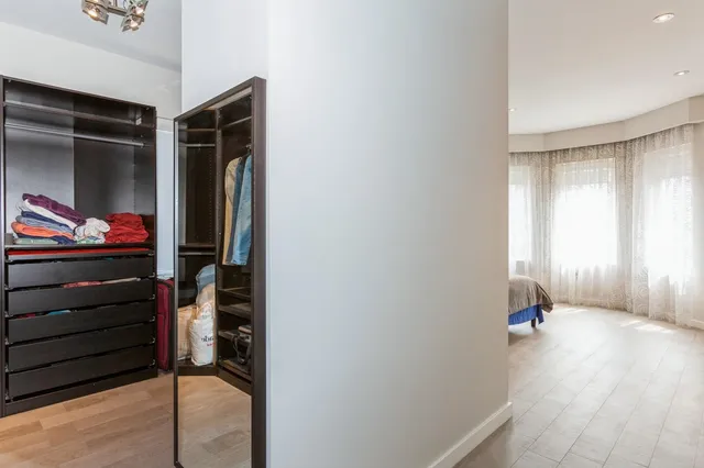 a view of an entryway with wooden floor