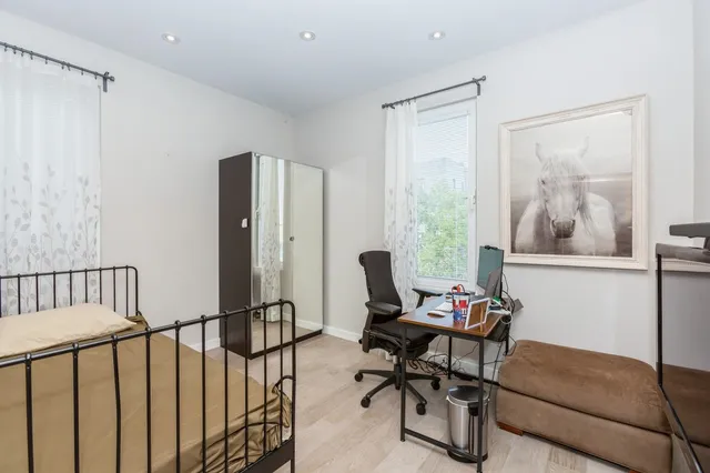 a work room with furniture and a window