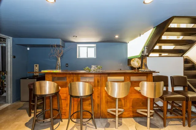 a dining room with chairs and chandelier
