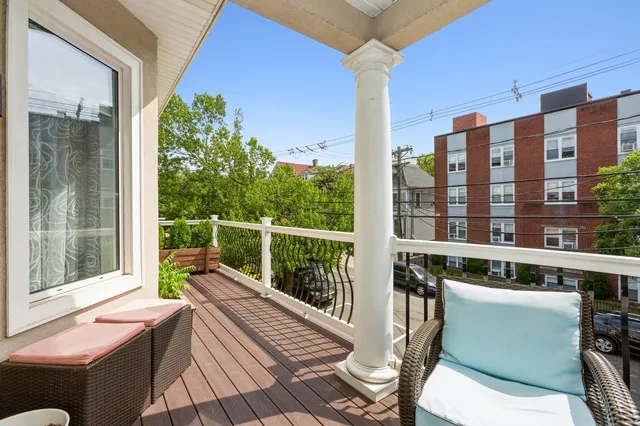 a view of balcony with a potted plant and wooden floor
