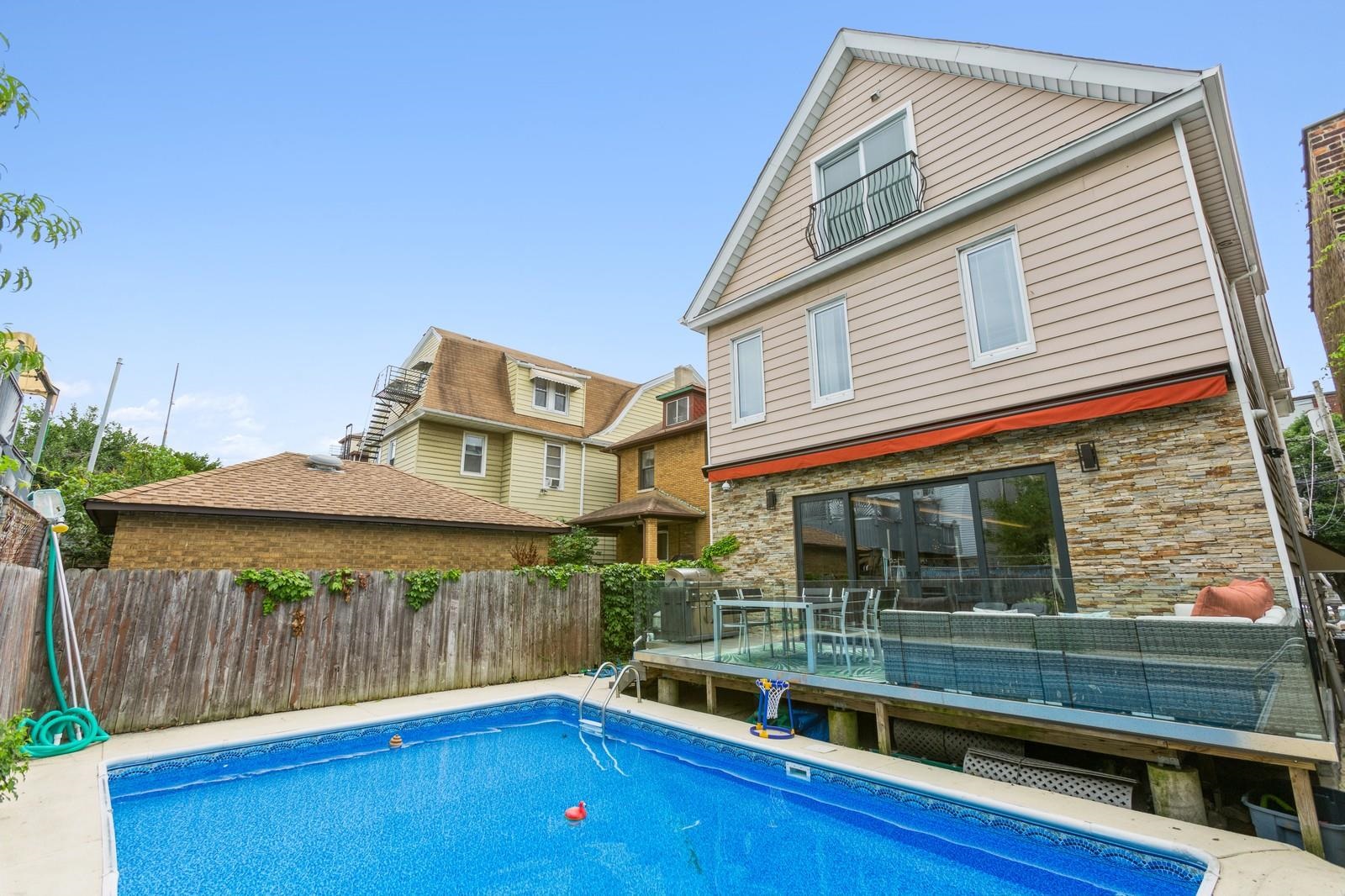 96 Columbia Terrace, Unit 1 Weehawken, NJ 07086 - Photo 33 of 40 a front view of a house with glass top table and chairs