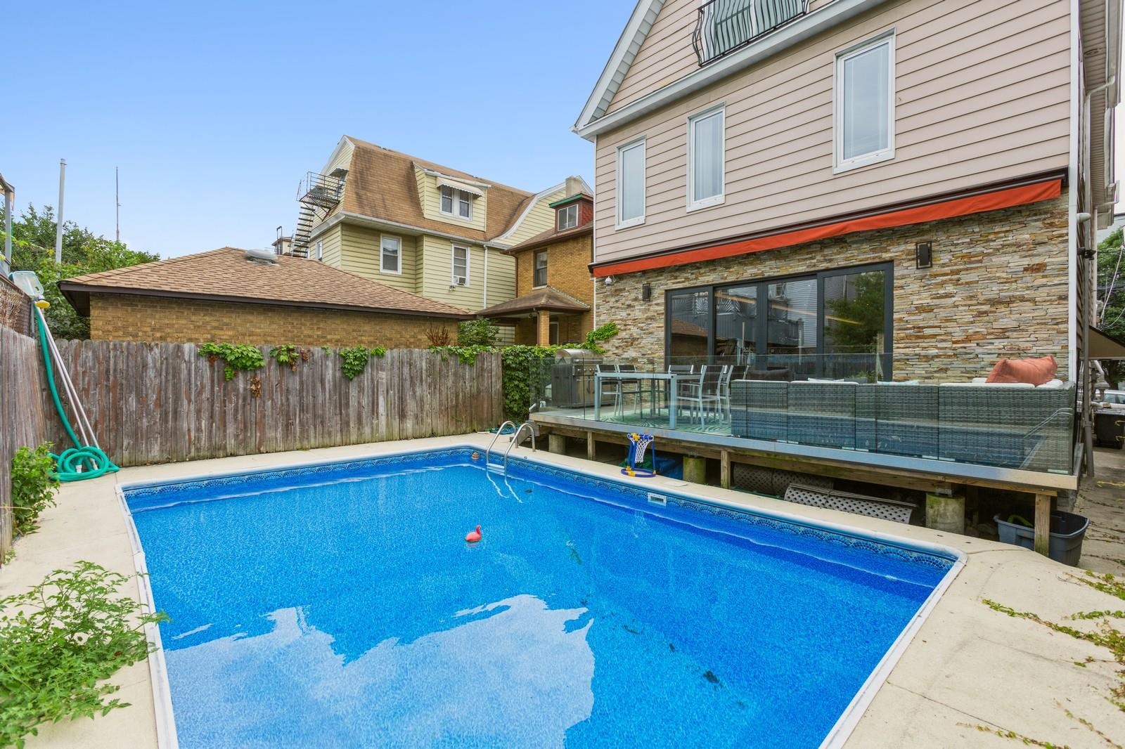 96 Columbia Terrace, Unit 1 Weehawken, NJ 07086 - Photo 34 of 40 a view of a house with a swimming pool