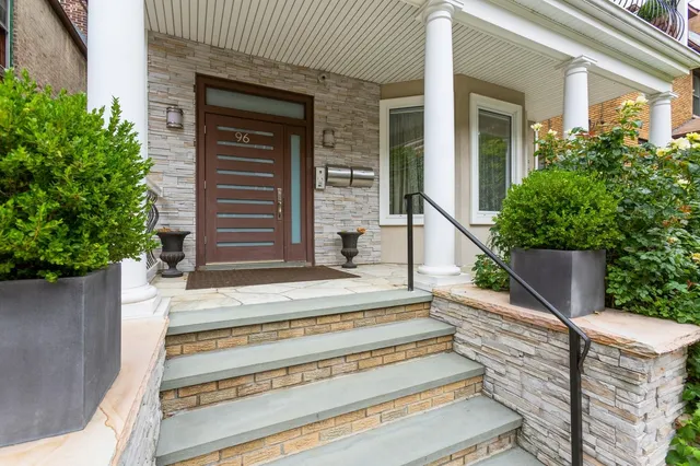 a view of house entrance and stairs