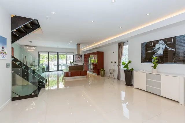 a view of a livingroom with furniture and a flat screen tv
