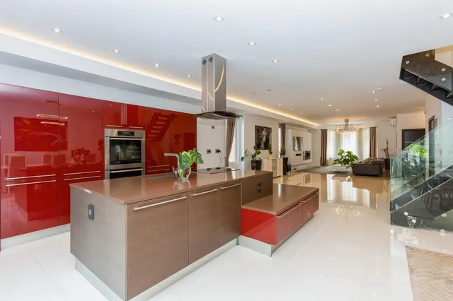a kitchen with stainless steel appliances granite countertop sink stove and refrigerator