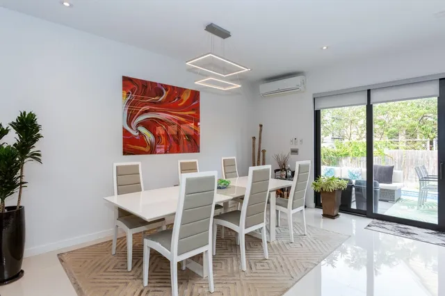 a view of a dining room with furniture window and outside view