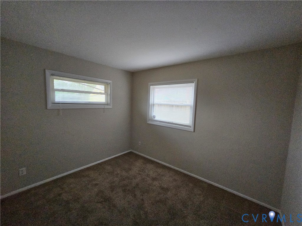 1313 Wembly Road Henrico, VA 23229 - Photo 11 of 17 Unfurnished room featuring dark carpet and baseboa