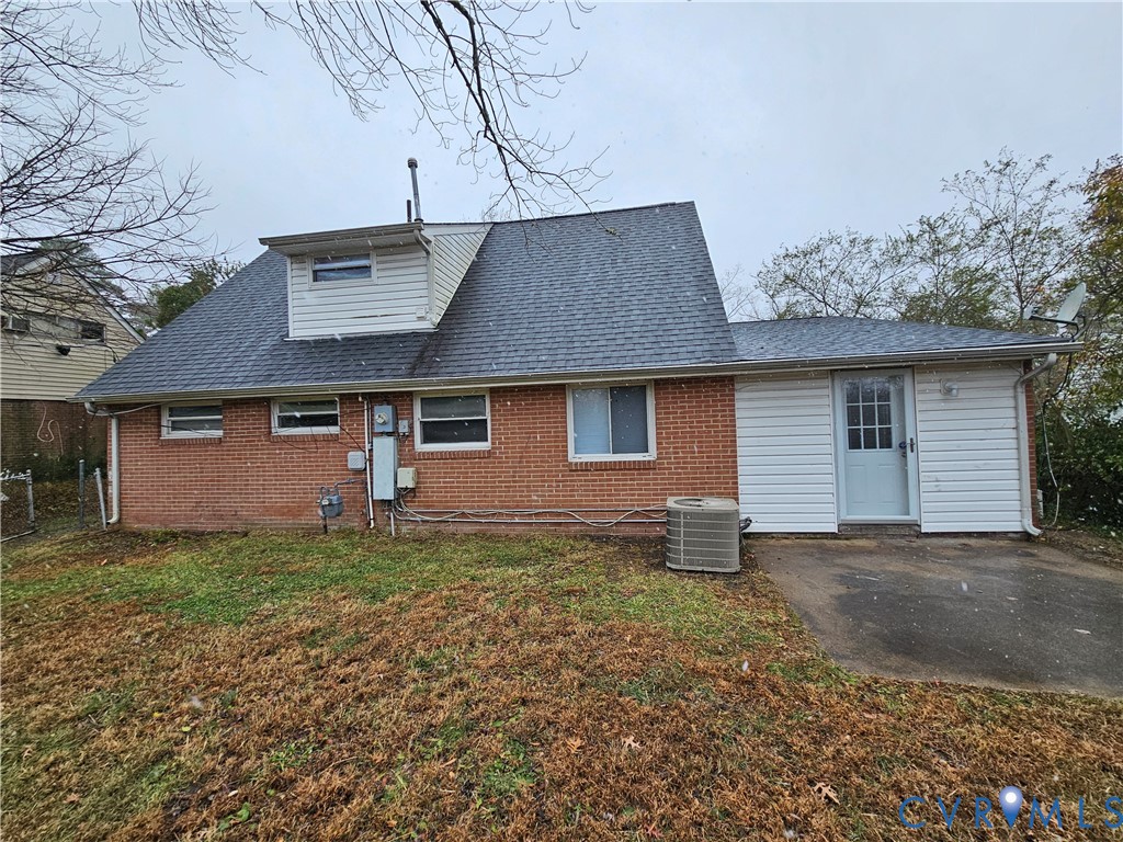 1313 Wembly Road Henrico, VA 23229 - Photo 2 of 17 Back of house with roof with shingles, a yard, and