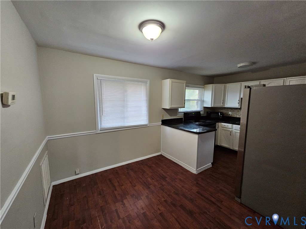1313 Wembly Road Henrico, VA 23229 - Photo 5 of 17 Kitchen featuring freestanding refrigerator, dark