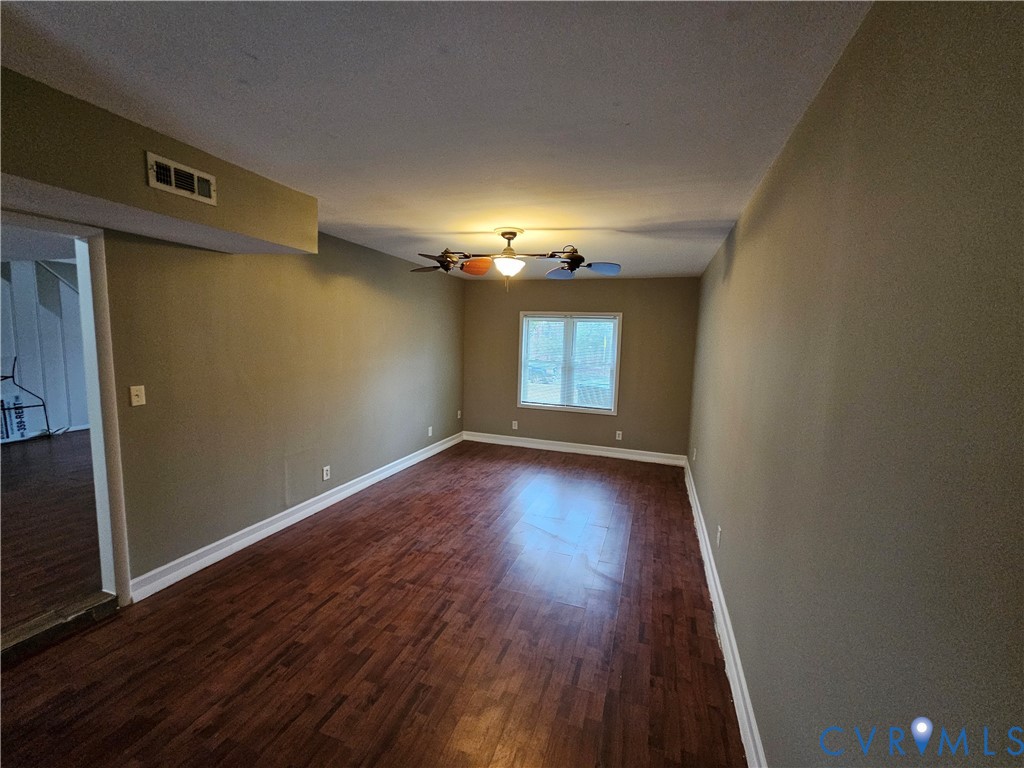 1313 Wembly Road Henrico, VA 23229 - Photo 8 of 17 Empty room featuring dark wood-style flooring and