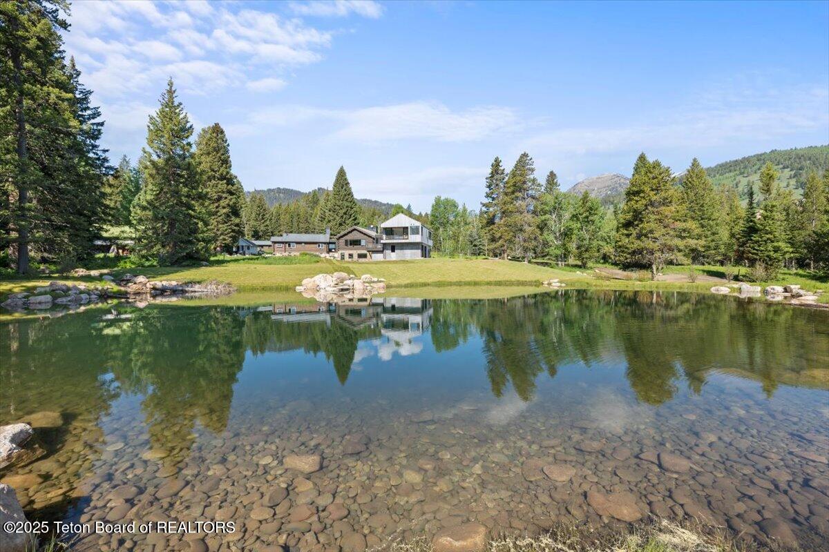7000 West Gill Huff Road Wilson, WY 83014 - Photo 37 of 37 Exterior from a distance with pond