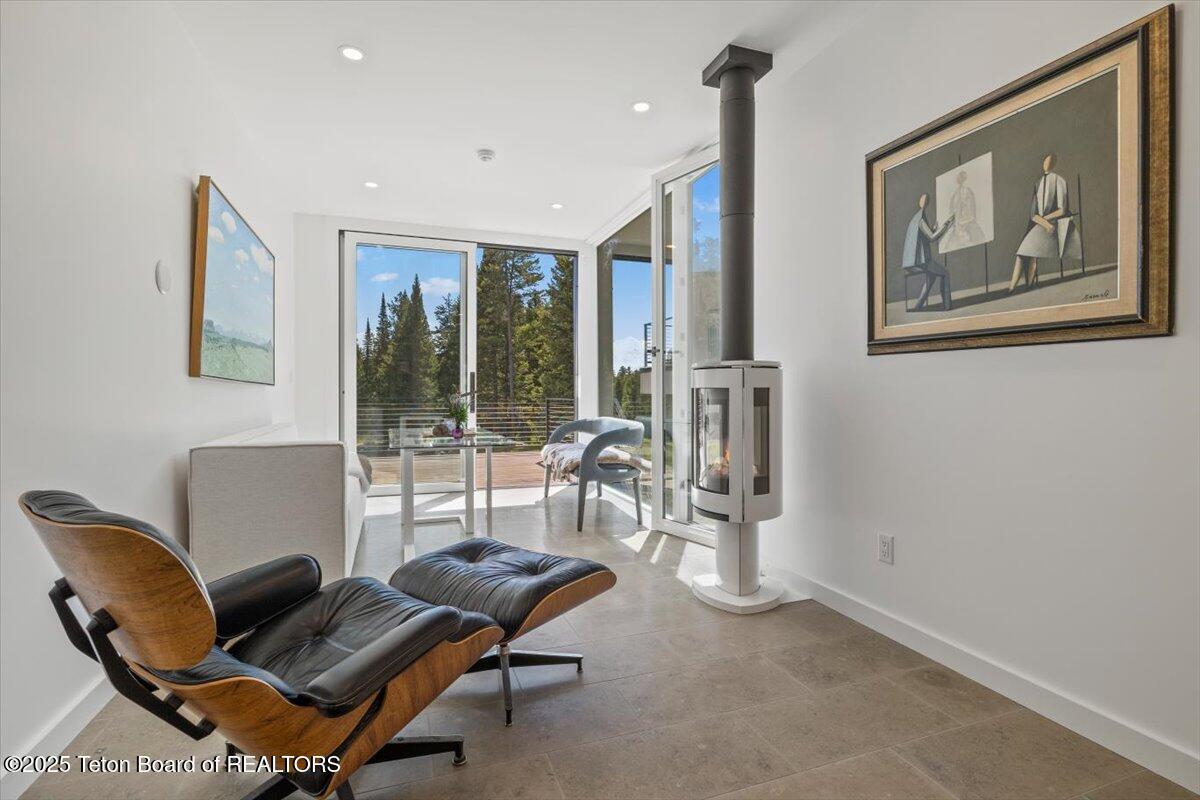 7000 West Gill Huff Road Wilson, WY 83014 - Photo 9 of 37 Sunroom, reading room.