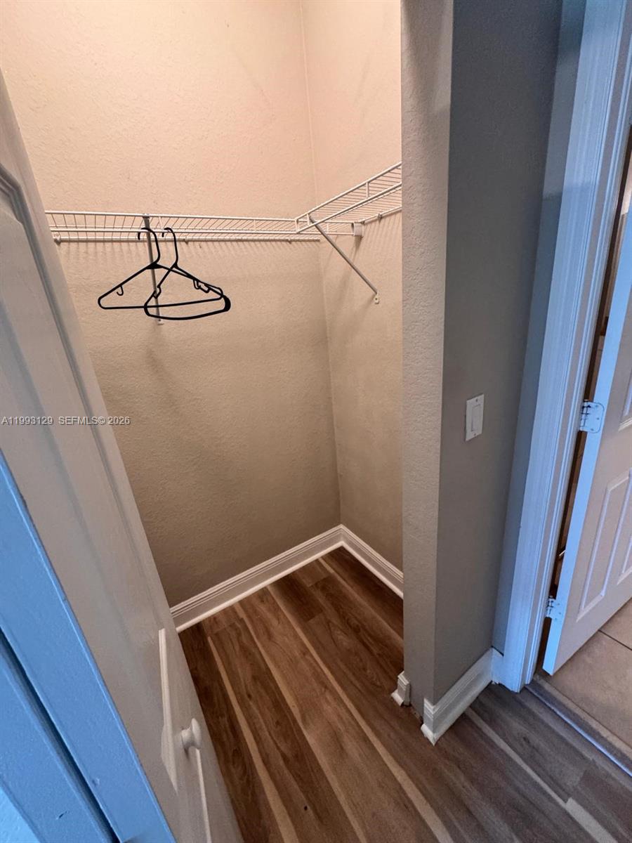 11980 Southwest 29th Street Miramar, FL 33025 - Photo 35 of 56 a view of a hallway with wooden floor and staircase