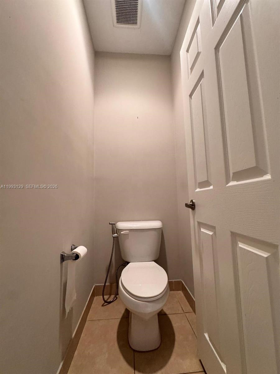 11980 Southwest 29th Street Miramar, FL 33025 - Photo 38 of 56 a bathroom with a toilet