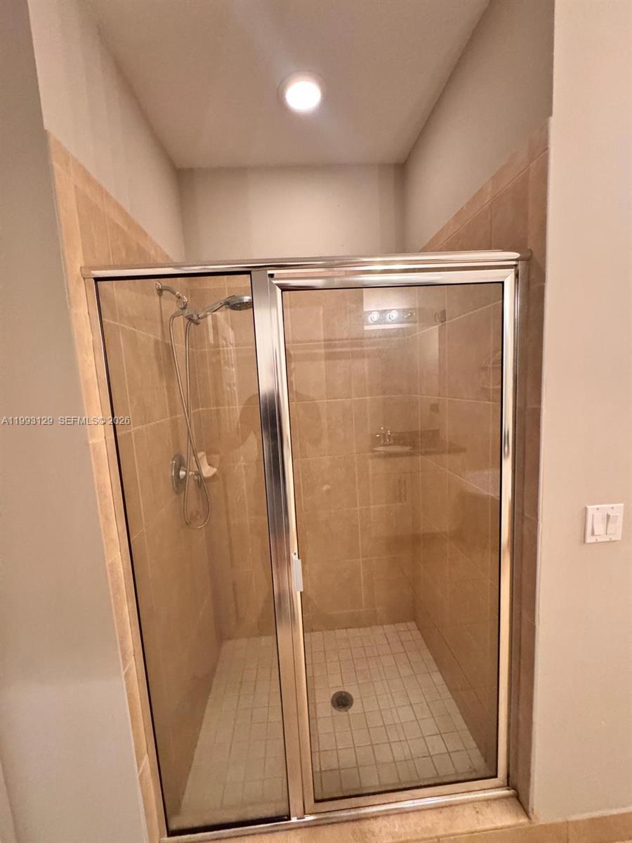 11980 Southwest 29th Street Miramar, FL 33025 - Photo 39 of 56 a bathroom with a glass shower door