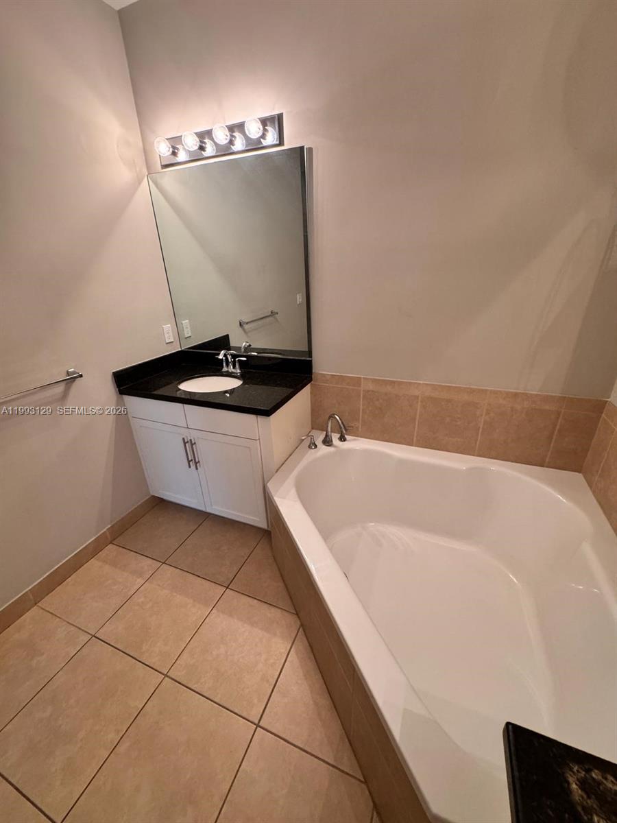 11980 Southwest 29th Street Miramar, FL 33025 - Photo 41 of 56 a bathroom with a bathtub and a sink