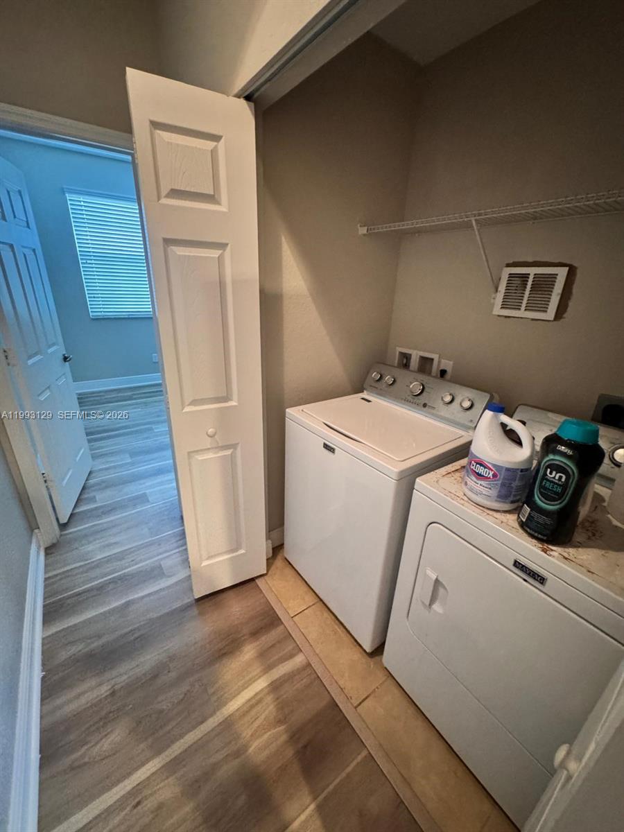 11980 Southwest 29th Street Miramar, FL 33025 - Photo 47 of 56 a utility room with dryer and washer