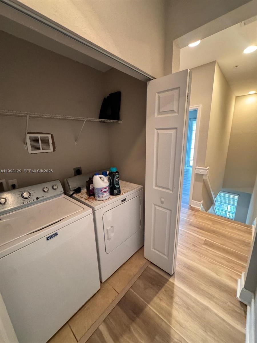 11980 Southwest 29th Street Miramar, FL 33025 - Photo 48 of 56 a view of storage and utility room with washer and dryer