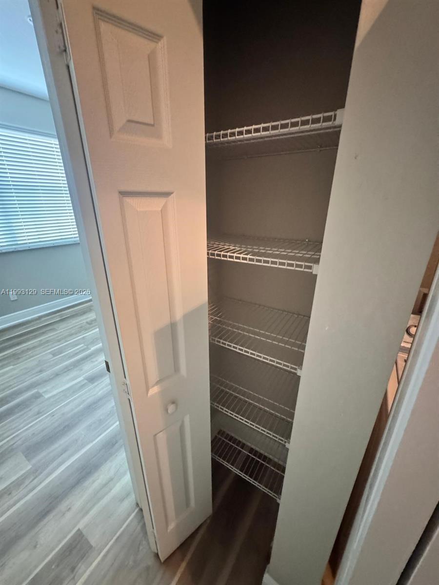 11980 Southwest 29th Street Miramar, FL 33025 - Photo 49 of 56 a view of staircase with white walls and railing