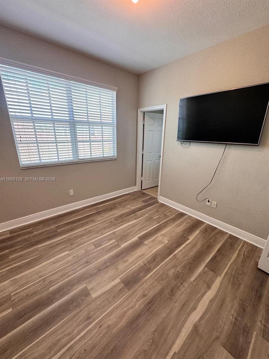 11980 Southwest 29th Street Miramar, FL 33025 - Photo 50 of 56 a view of a livingroom with an empty space and a window