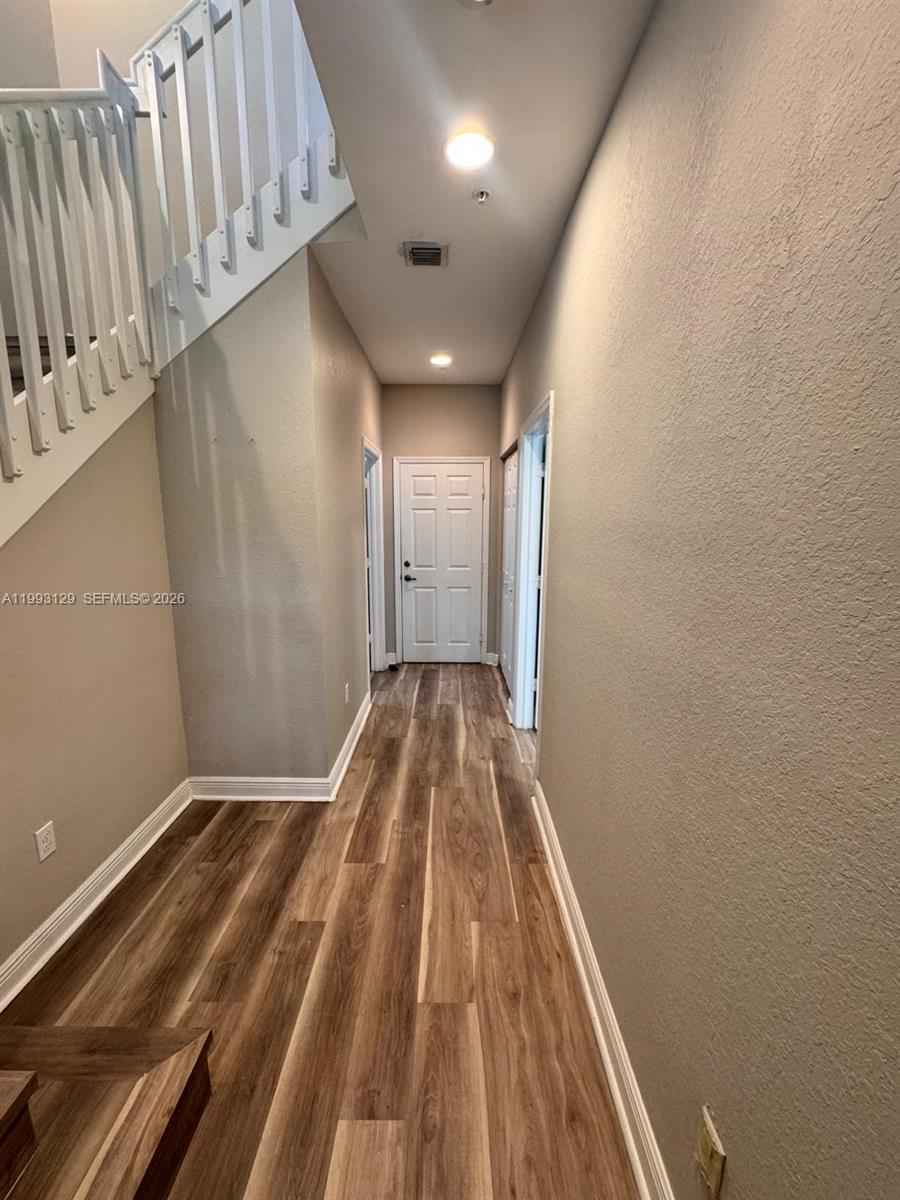 11980 Southwest 29th Street Miramar, FL 33025 - Photo 6 of 56 a view of a room with wooden floor