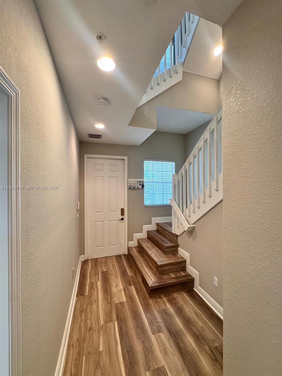 11980 Southwest 29th Street Miramar, FL 33025 - Photo 8 of 56 a view of livingroom with stairs and furniture