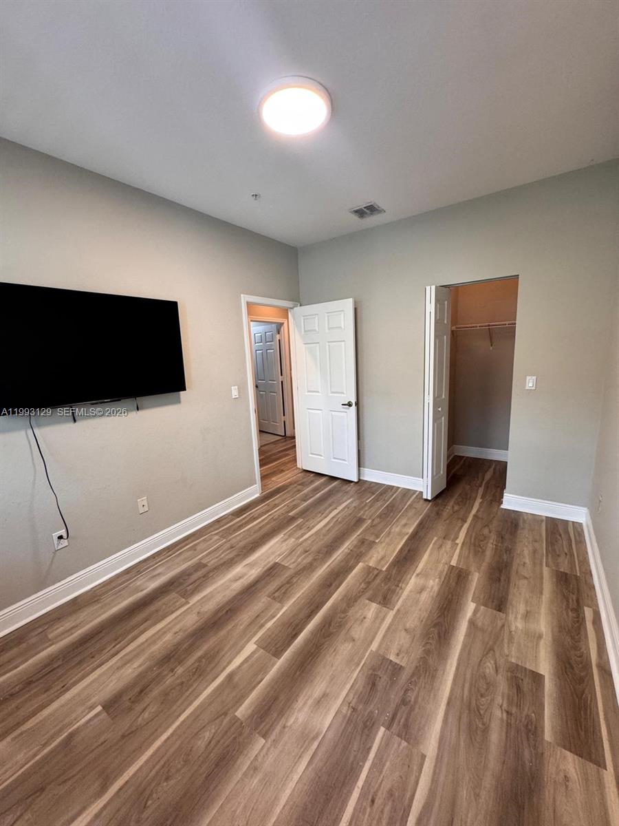 11980 Southwest 29th Street Miramar, FL 33025 - Photo 10 of 56 a view of a livingroom with wooden floor