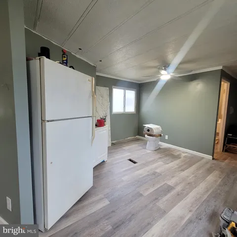 a bathroom with a sink a toilet a tub and shower