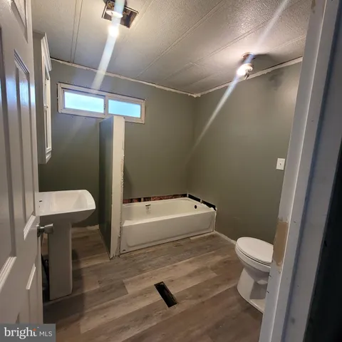 a room with furniture and wooden floor