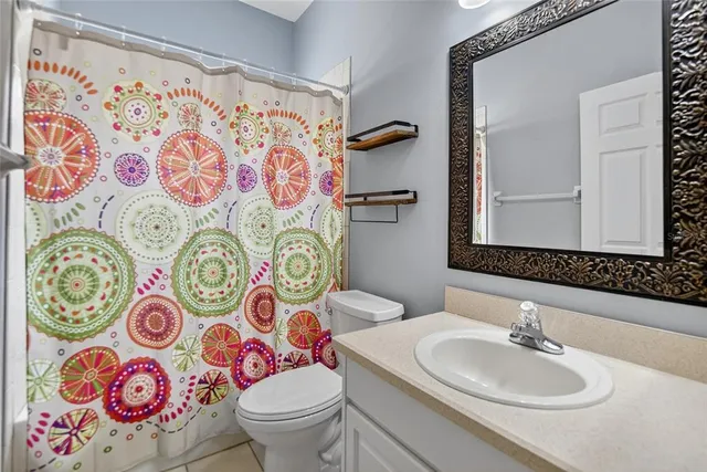 a bedroom with bed and a window