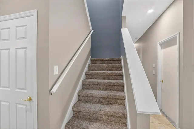 a view of an empty room and a ceiling fan