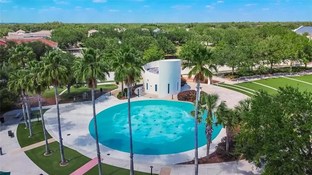 an aerial view of residential house with outdoor space and swimming pool