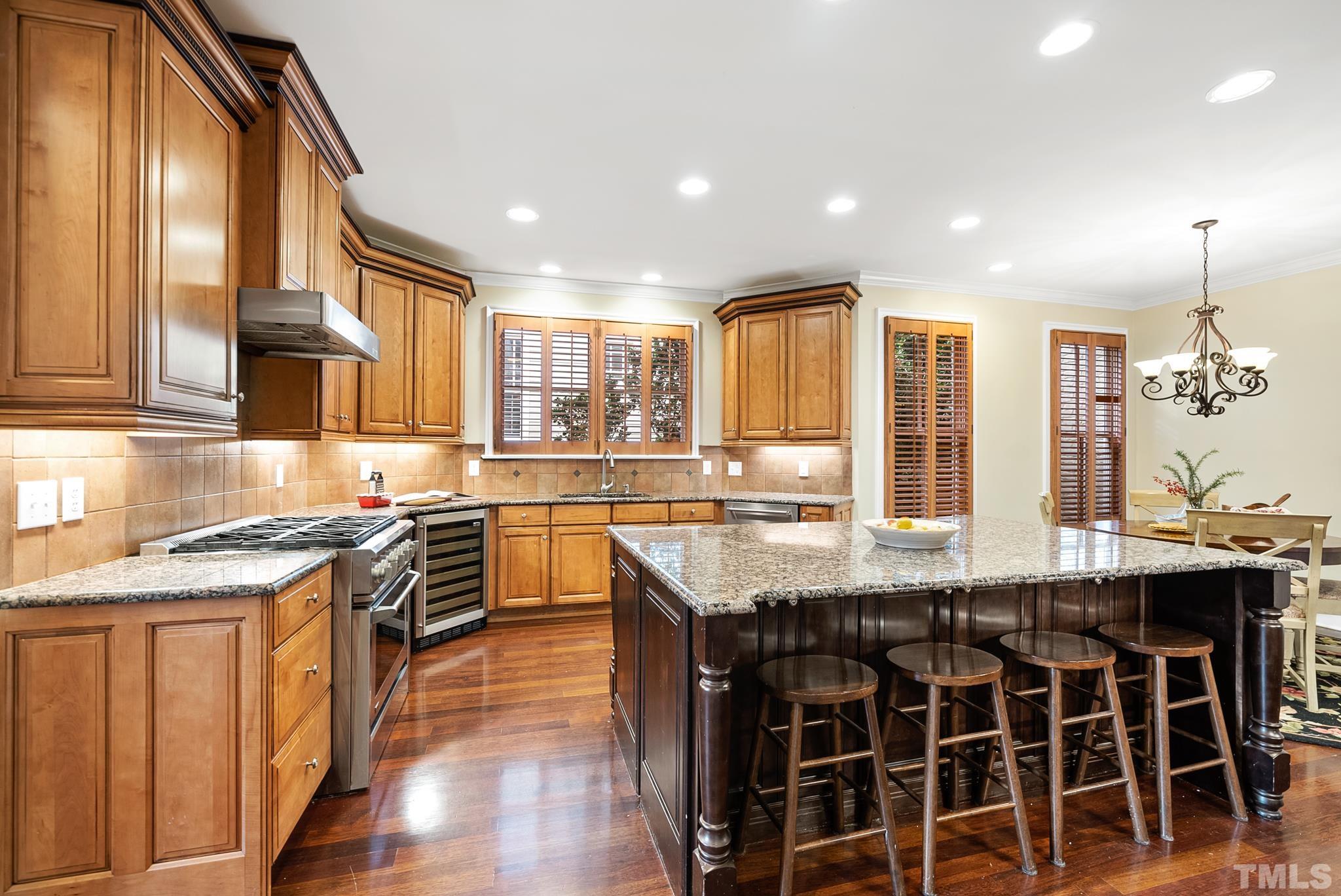 3044 Farrior Road Raleigh, NC 27607 - Photo 12 of 64 a kitchen with stainless steel appliances granite countertop counter space a sink and cabinets