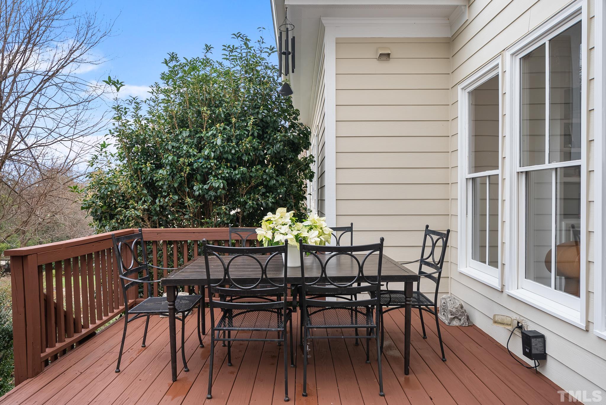 3044 Farrior Road Raleigh, NC 27607 - Photo 20 of 64 a view of a dinning table and chairs on deck with wooden floor