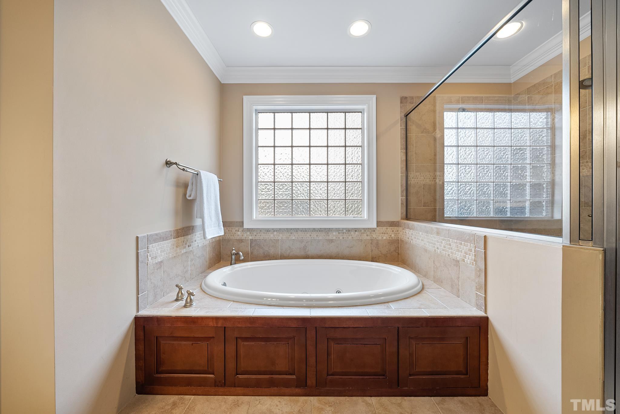 3044 Farrior Road Raleigh, NC 27607 - Photo 26 of 64 a bathroom with a sink and a bathtub