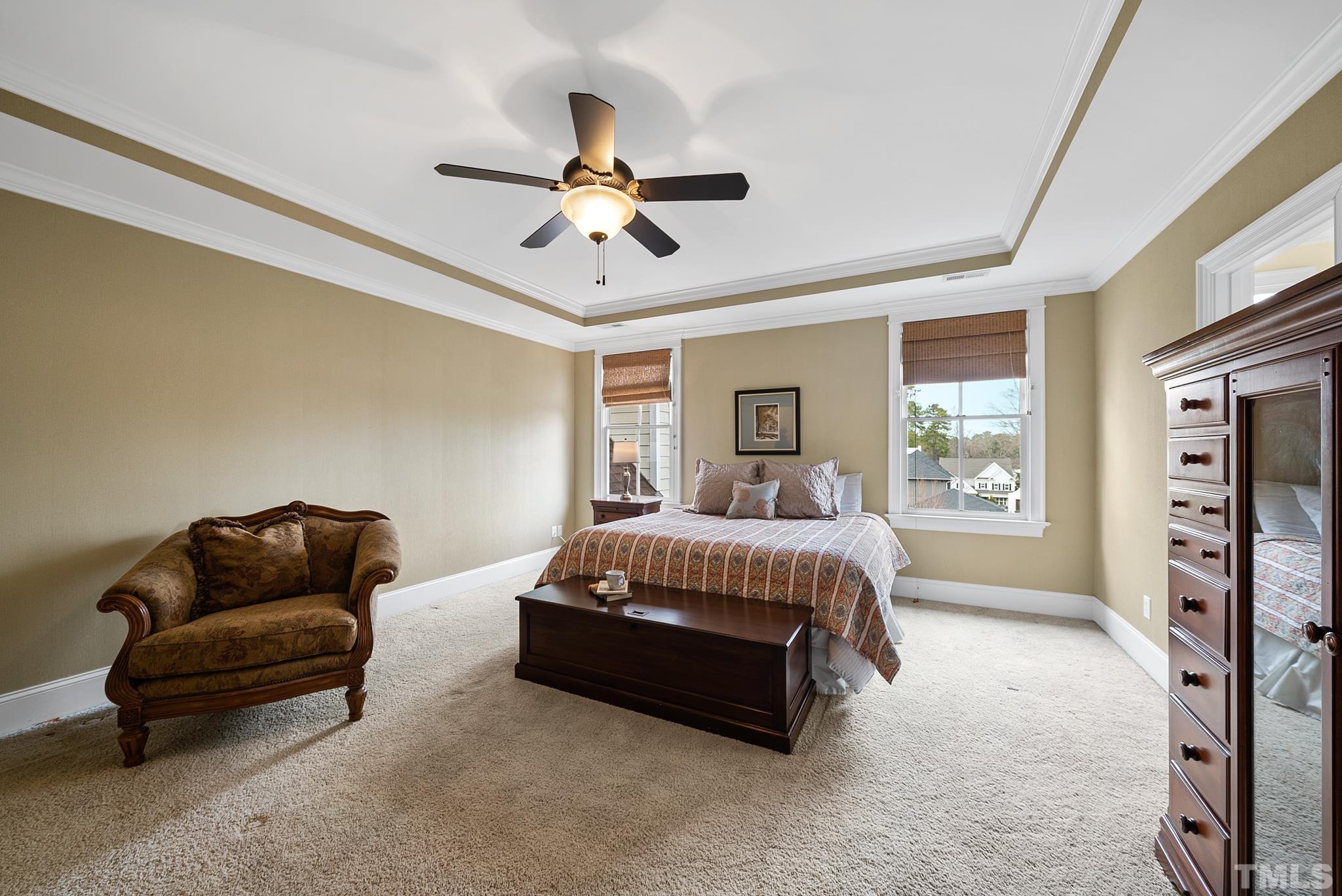 3044 Farrior Road Raleigh, NC 27607 - Photo 32 of 64 a spacious bedroom with a bed and couch
