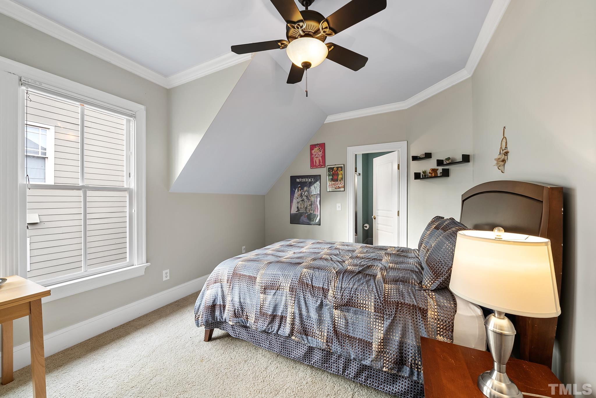 3044 Farrior Road Raleigh, NC 27607 - Photo 34 of 64 a bedroom with a bed table chair and a window