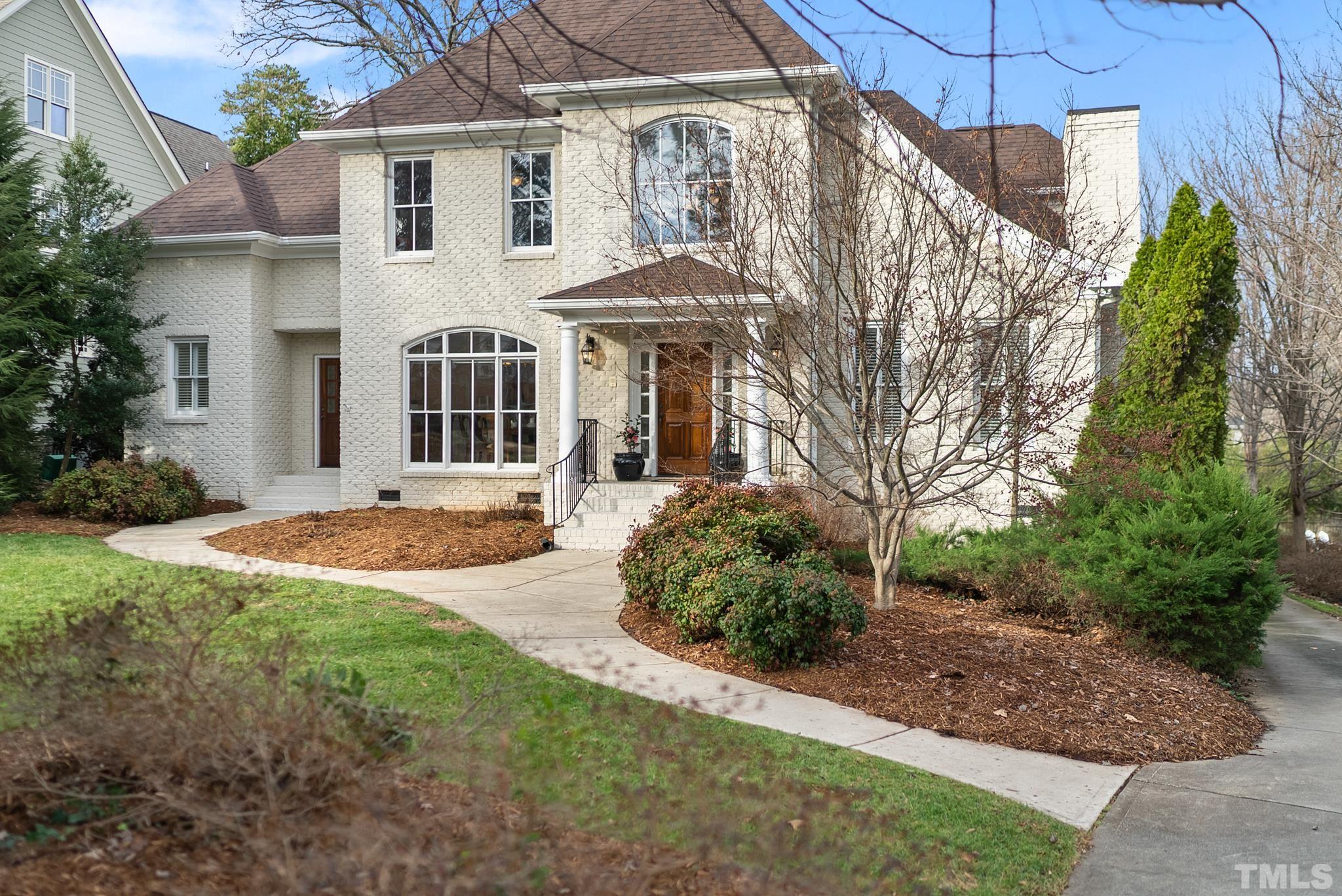 3044 Farrior Road Raleigh, NC 27607 - Photo 56 of 64 a front view of a house with a yard and trees