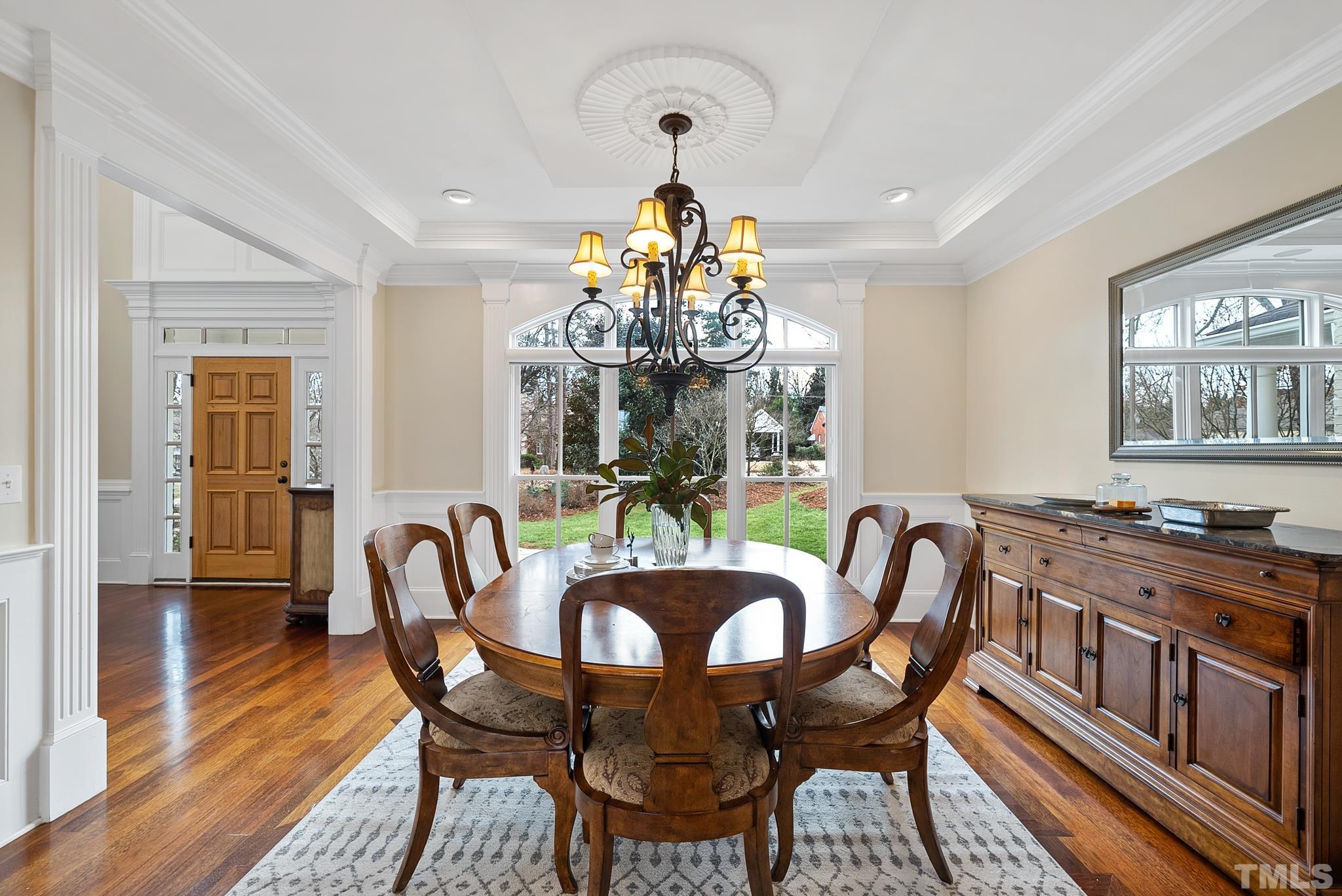 3044 Farrior Road Raleigh, NC 27607 - Photo 6 of 64 a dining room with furniture a livingroom and chandelier