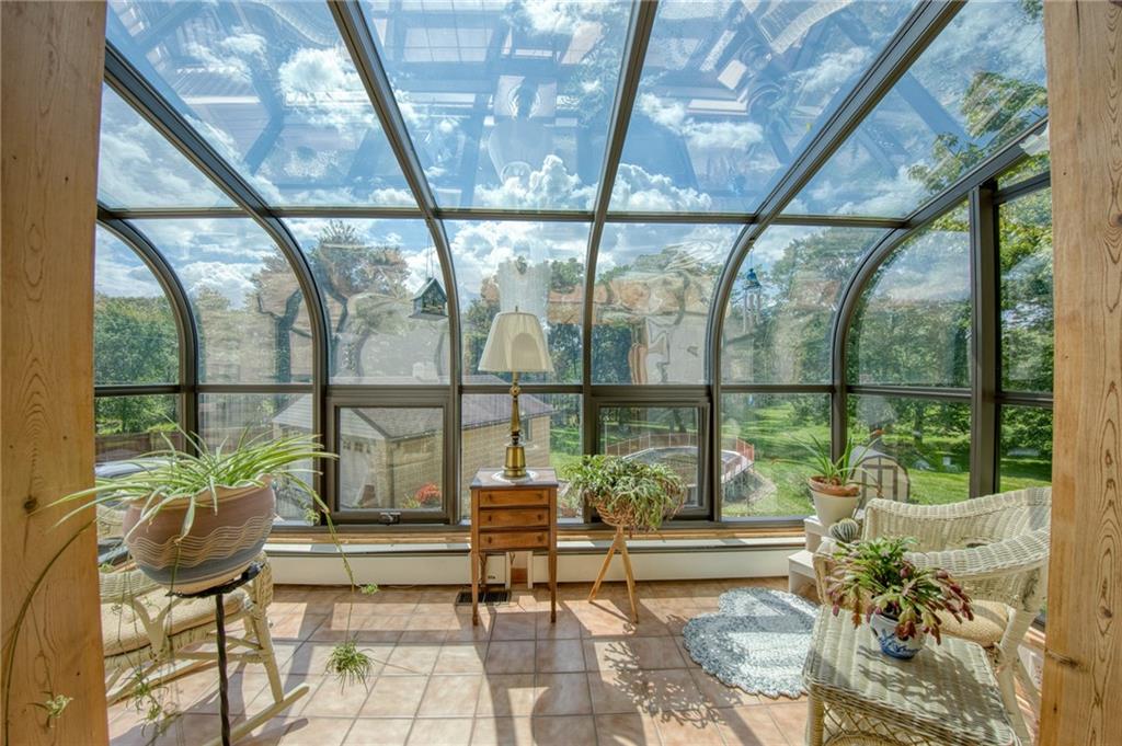 668 Bairdford Road Gibsonia, PA 15044 - Photo 35 of 47 Beautiful solarium for enjoying mother nature year round. Notice the 2 car garage in the back ground.