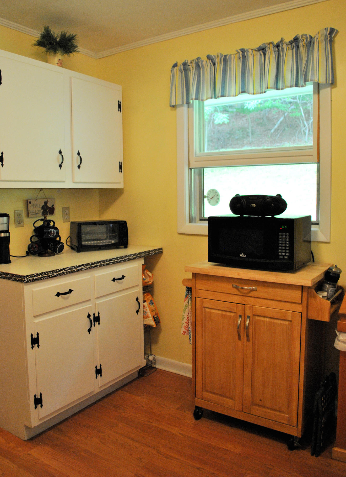 219 Berryhill Road Northwest Riner, VA 24149 - Photo 13 of 54 a kitchen with stainless steel appliances granite countertop a stove a sink and a microwave