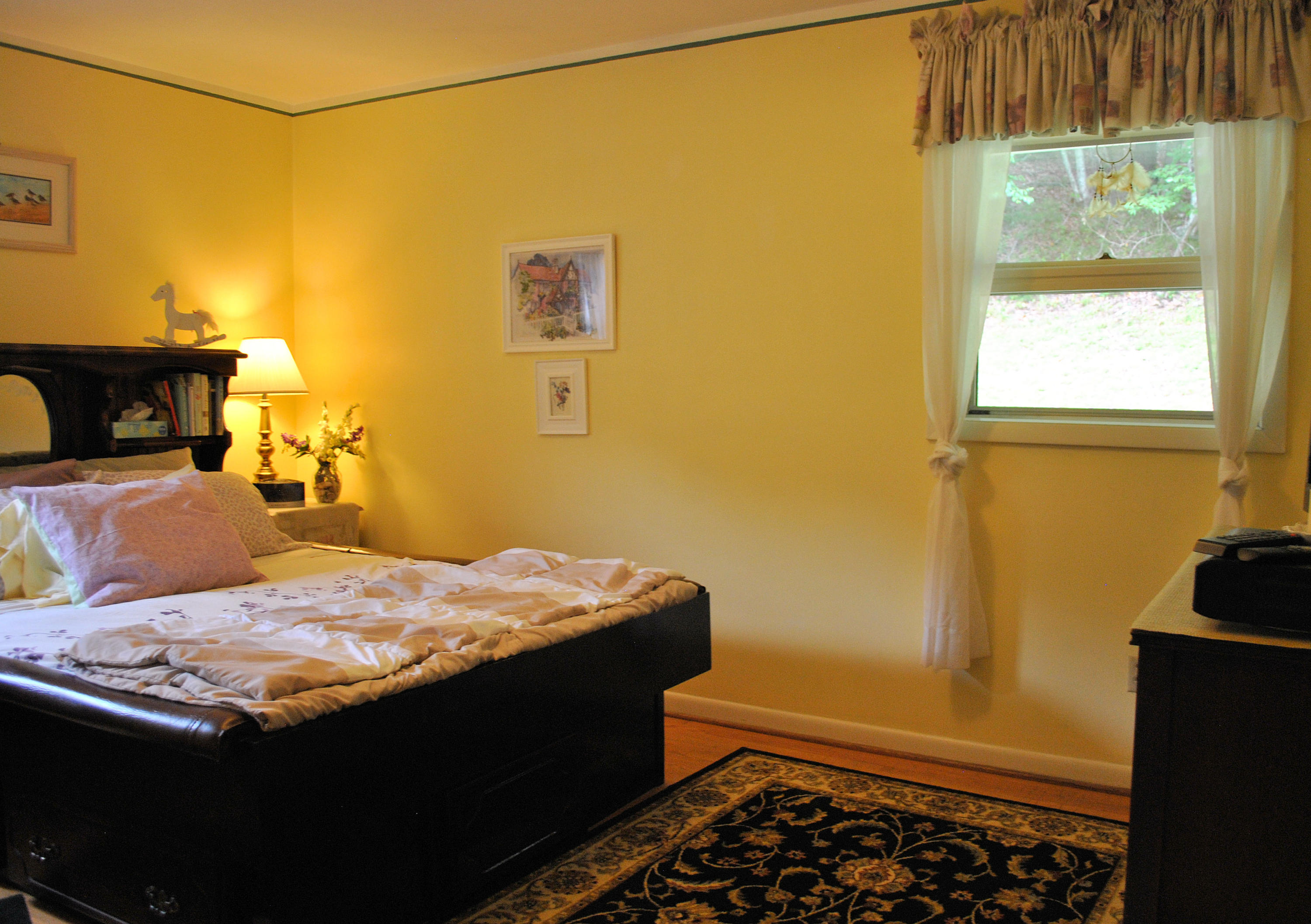 219 Berryhill Road Northwest Riner, VA 24149 - Photo 18 of 54 a bedroom with a bed and dresser