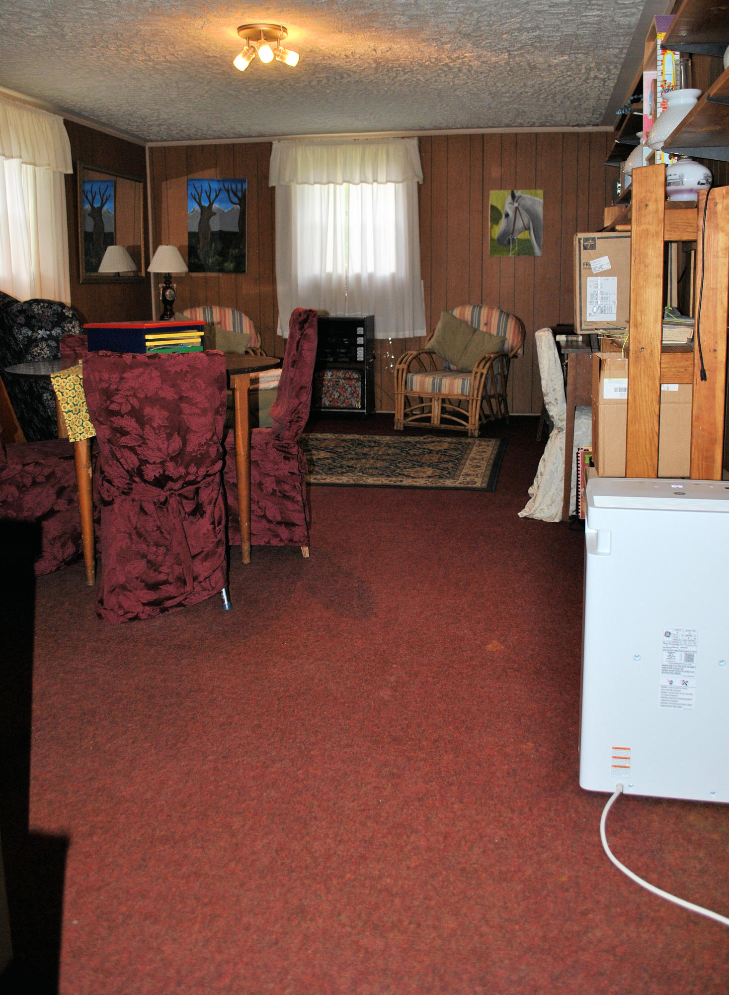 219 Berryhill Road Northwest Riner, VA 24149 - Photo 29 of 54 a living room with furniture a window and a flat screen tv
