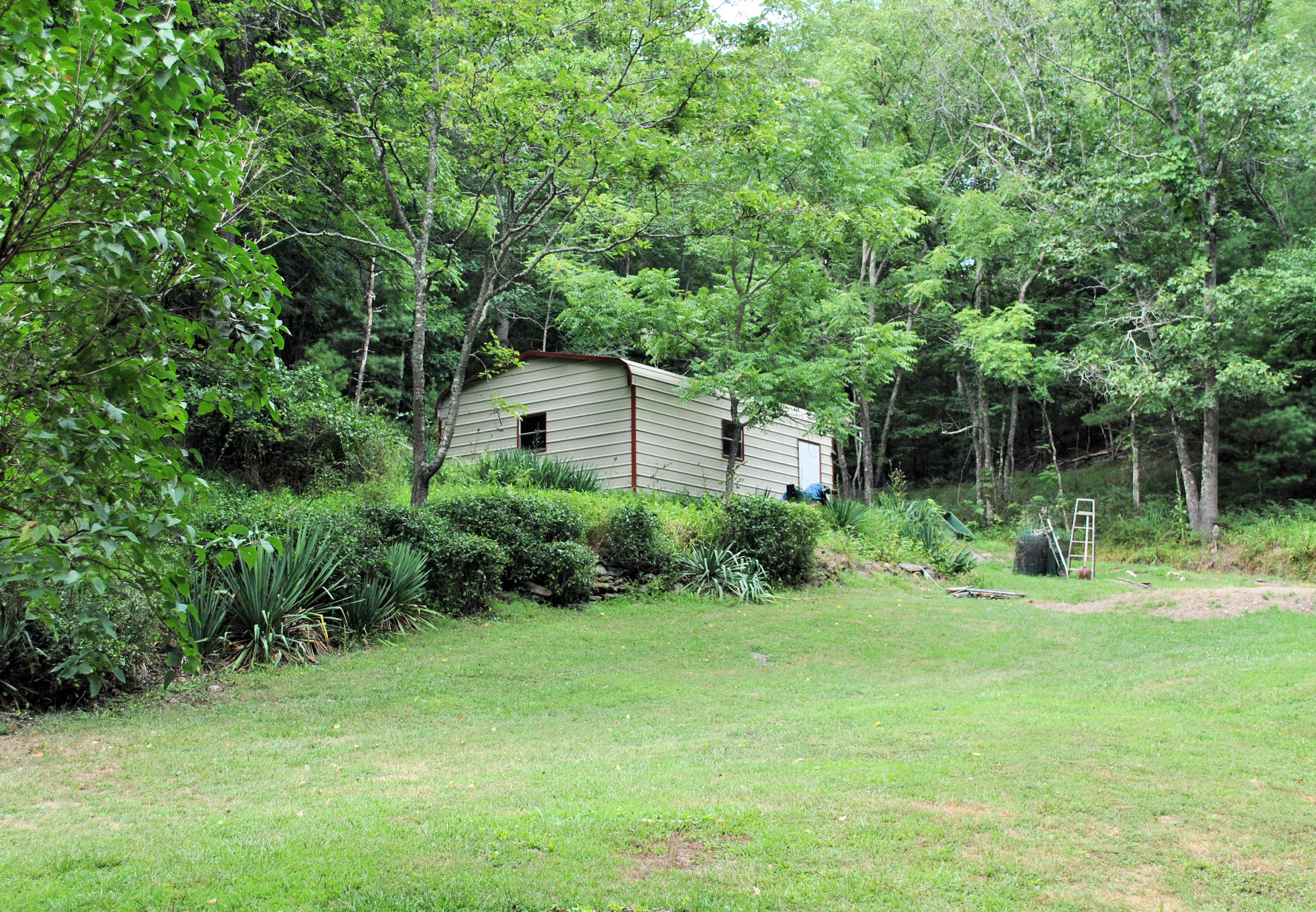 219 Berryhill Road Northwest Riner, VA 24149 - Photo 39 of 54 a house view with a garden space