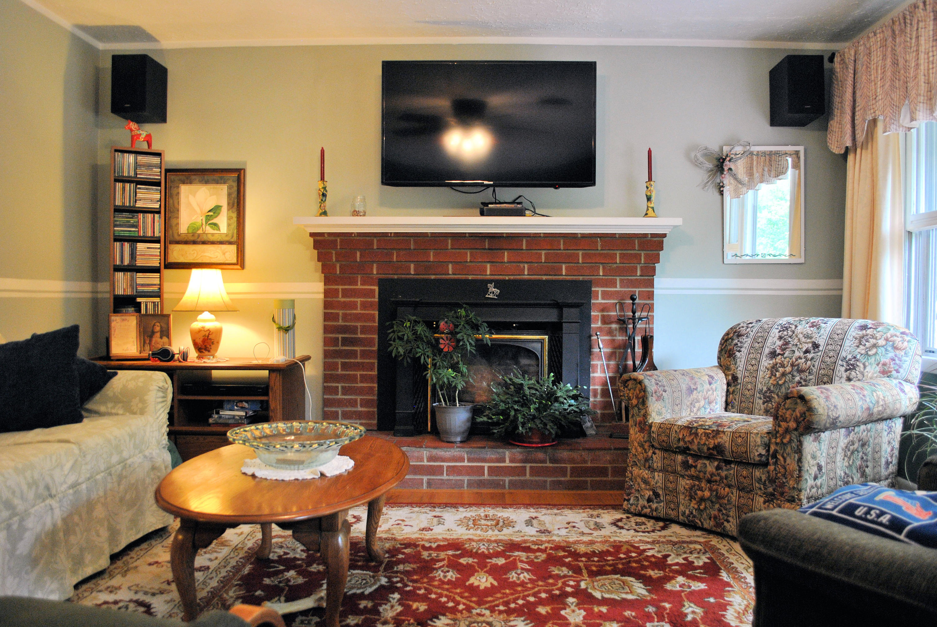 219 Berryhill Road Northwest Riner, VA 24149 - Photo 7 of 54 a living room with furniture a flat screen tv and a fireplace