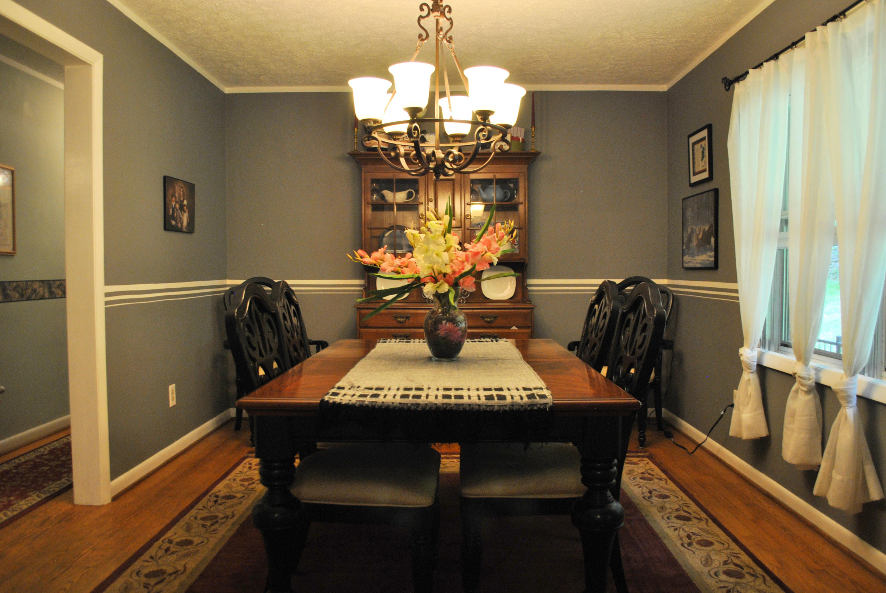 219 Berryhill Road Northwest Riner, VA 24149 - Photo 10 of 54 a view of a dining room with furniture and chandelier