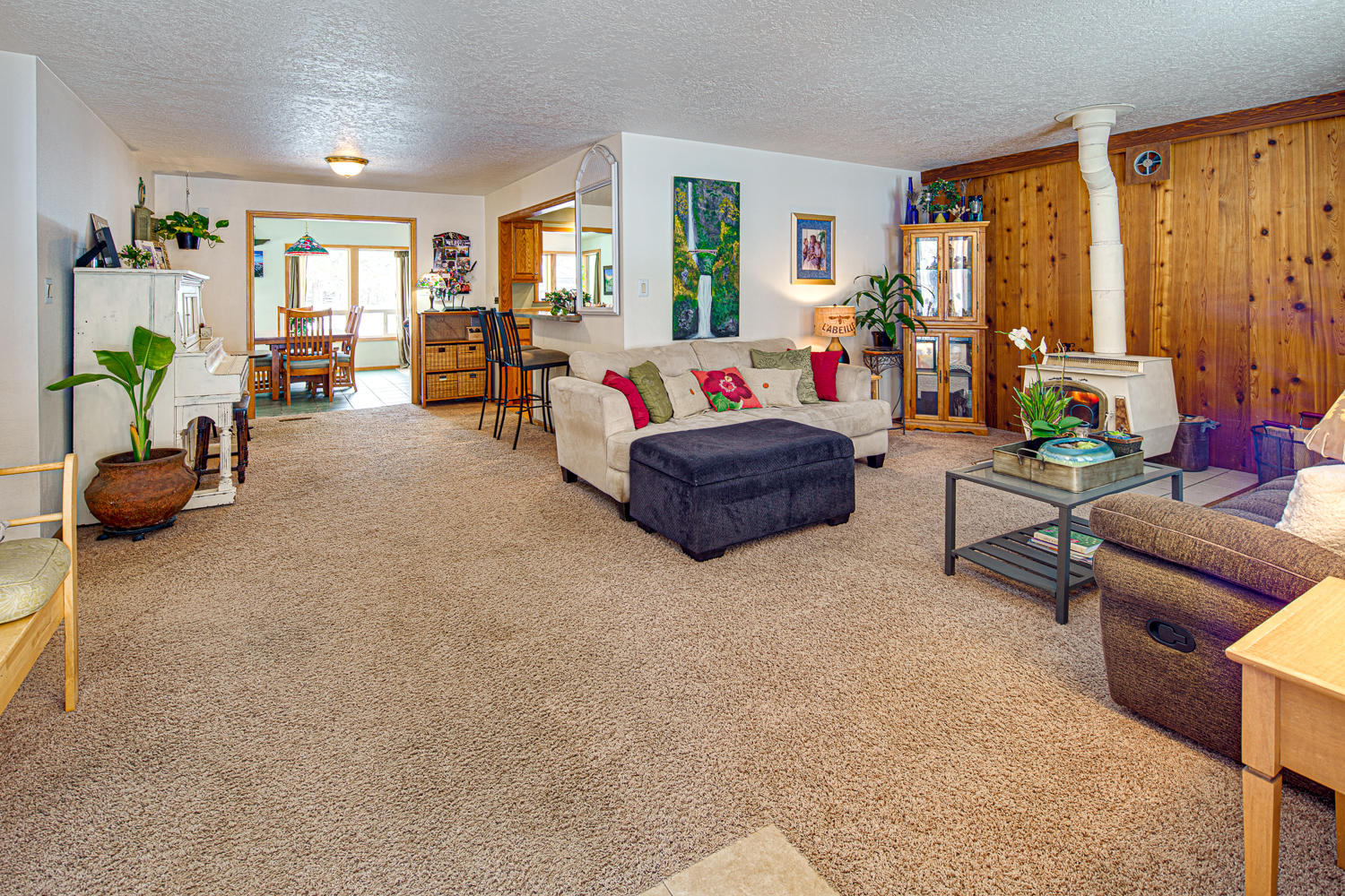 22145 Neff Road Bend, OR 97701 - Photo 12 of 50 a living room with furniture and large windows