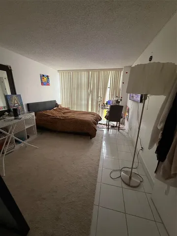a bathroom with a double vanity sink a mirror and a bathtub