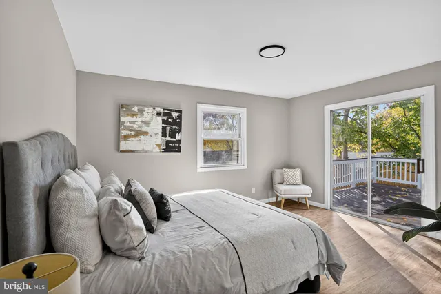 a bedroom with a bed couch and window